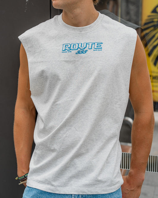 Person wearing a sleeveless gray shirt with 'ROUTE 333' logo, standing outdoors.