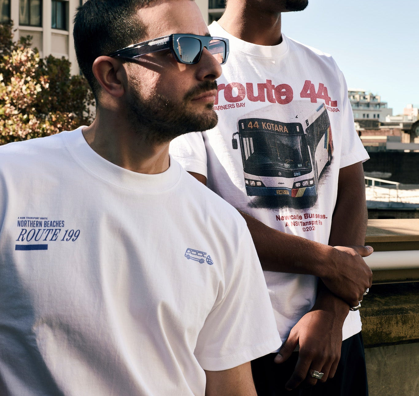 Two men wearing Route 44 t-shirts in an urban setting
